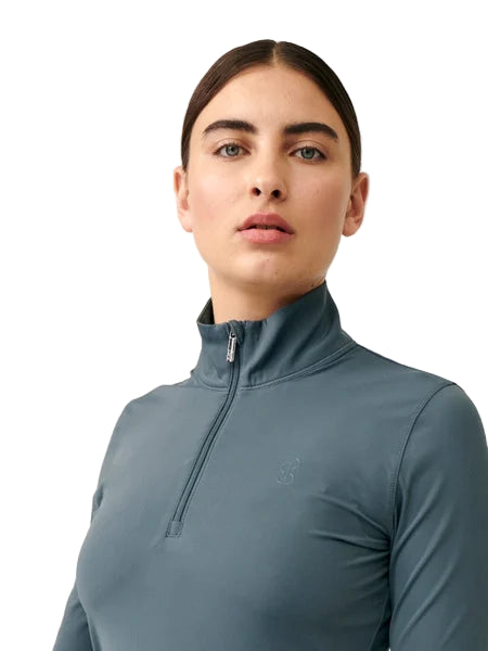Person wearing a blue pullover with a zipper on a white background
